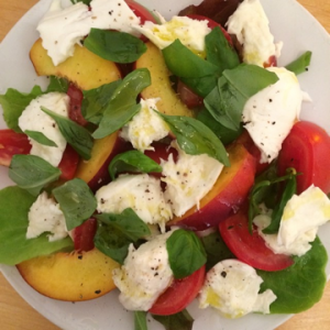 Tomatoes with peaches, basil and mozzarella cheese